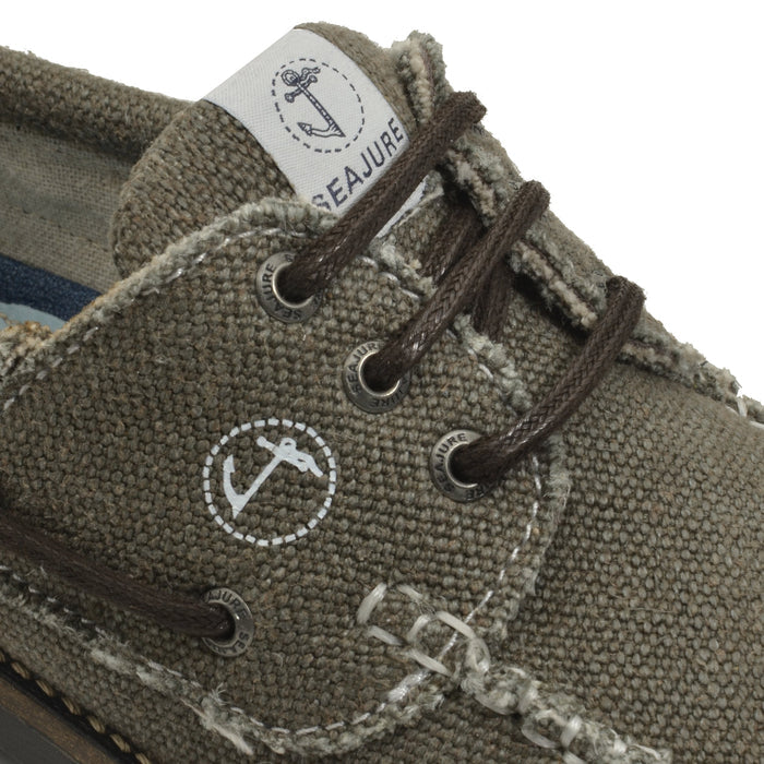 Close-up detail of Seajure Vik showing logo emblem and organic hemp fabric texture