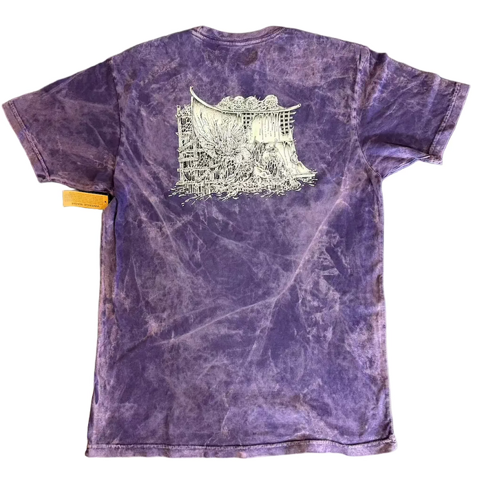 Purple t-shirt with a white graphic design on a textured surface