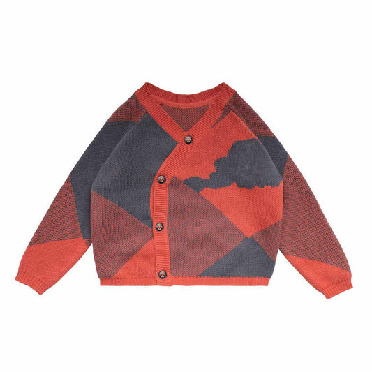 Blue and orange knitted cotton baby cardigan against a clean background