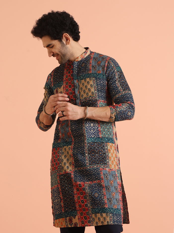 The model is standing straight with hands on buttons, posing in Kisah's multi colour kurta for men
