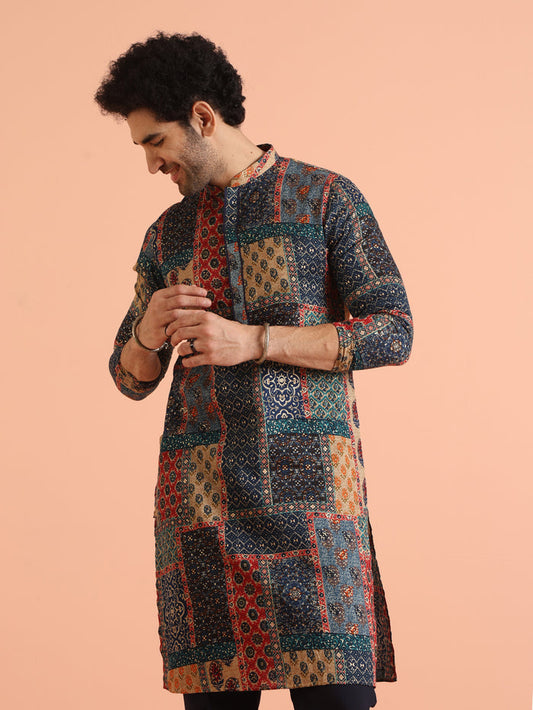 The model is standing straight with hands on buttons, posing in Kisah's multi colour kurta for men