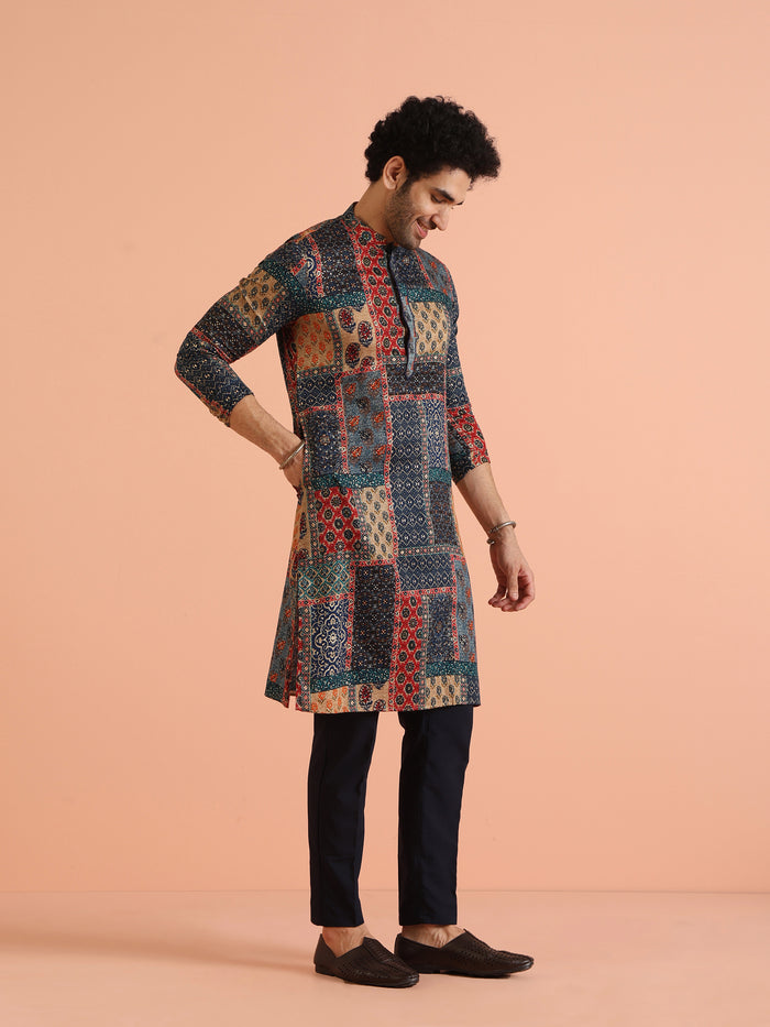The side view of the model highlights Kisah's multi colour kurta for men with patchwork cotton prints