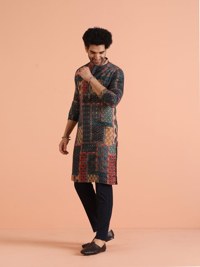 The model is looking downward, posing gracefully in Kisah's Multi Color Cotton Printed multi colour kurta for men
