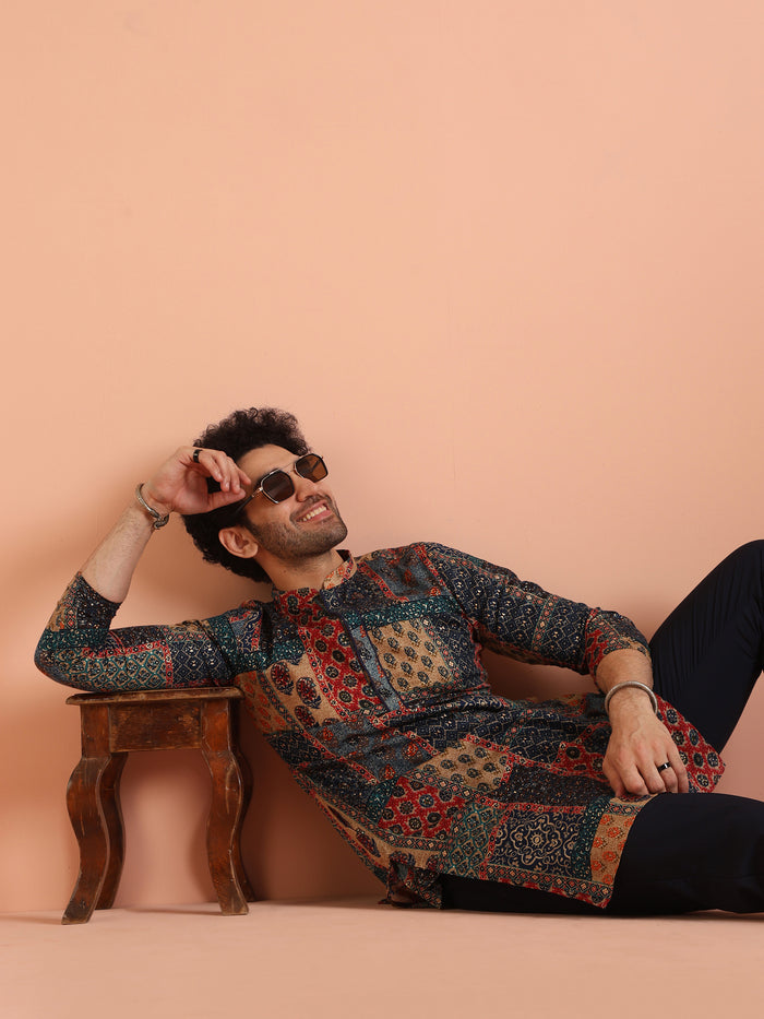 The model is seated on the floor leaning back, wearing Kisah's Multi Color Cotton Printed Kurta stylishly