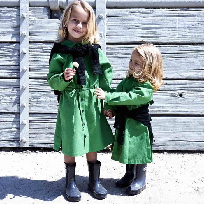 Girl wearing a green meadow shirt dress outdoors