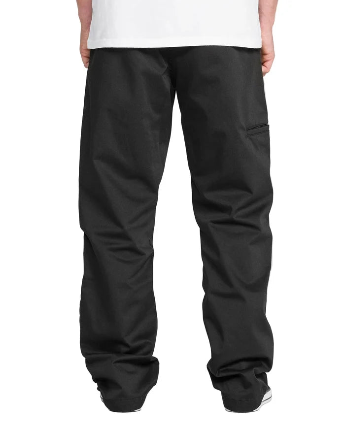 Person wearing black pants on a white background